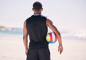 Image showing Beach, sports and back of man with volleyball for training, exercise and morning cardio in nature. Ocean, games and rear view of male player at sea for fun, fitness and workout, performance or match