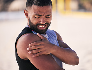 Image showing Arm pain, sports and man at a beach for volleyball, fitness and performance training with problem. Shoulder, injury and male player with arthritis, fibromyalgia or osteoporosis crisis during workout