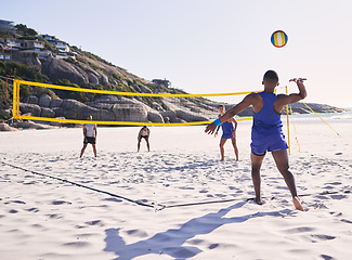 Image showing Beach, volleyball and man serve on team with competition at ocean with exercise, sport and fitness. Summer, outdoor and training people play for health, holiday games and workout activity in nature