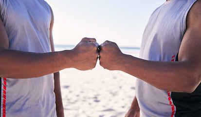 Image showing Fist bump, fitness and teamwork with men on the beach for sports motivation together in unity or solidarity. Hands, exercise and support with an athlete team outdoor on the sand for competition