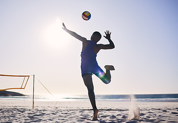 Image showing Back, silhouette and a person with a volleyball at the beach for a game or sports competition. Fitness, nature and an athlete playing, training or doing cardio workout at the ocean in summer