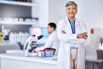 Image showing Portrait, research and senior woman with arms crossed, medical and scientist with lab equipment, smile and growth. Female person, confidence and healthcare professional with science and innovation