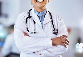 Image showing Doctor, arms crossed and stethoscope of a woman in a hospital for healthcare or cardiology. Closeup of a professional female medical worker ready for consultation, medicine and health check up