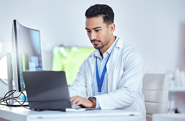 Image showing Scientist, serious man and working laptop in laboratory for medical research, innovation and data analysis. Asian male researcher focus on computer for digital test, biotechnology and science report