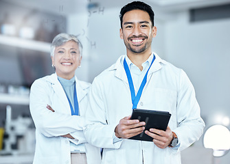 Image showing Pharmaceutical, tablet and portrait of a scientific team standing with confidence in laboratory. Happy, smile and scientists with digital technology working on medical project, research or experiment