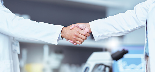 Image showing Hand shake, partnership and lab scientist, people or team work, collaboration and cooperation on medical science. Doctors, teamwork and closeup partner handshake for unity, agreement or staff welcome