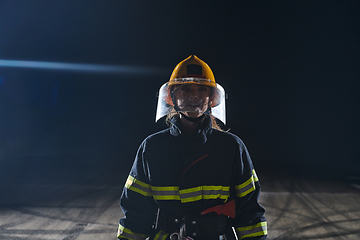 Image showing Portrait of a female firefighter standing and walking brave and optimistic