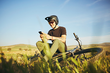 Image showing Phone, mountain bike and man outdoor in nature for extreme sports, training or workout. Smartphone, online communication and male person with bicycle for off road cycling, travel or adventure