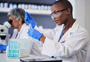 Image showing Science, black woman and pipette with tube for test, research and investigation in laboratory. Female scientist working with dropper to study liquid sample, review solution and innovation of vaccine