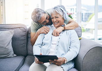 Image showing Laughing, hug and couple with a tablet for a website, streaming music or a podcast together. Love, embrace and a senior man and woman with a movie or funny video on technology or listening to audio