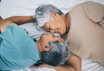 Image showing Bed, love and senior couple faces together in a bedroom bonding as care, playing and relax to enjoy retirement in a home. Happy, solidarity and elderly people, man and woman with trust in marriage