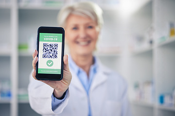 Image showing Woman, pharmacist and phone with QR code scan for covid certification or verification at pharmacy. Hands of female person, medical or healthcare professional show mobile smartphone app for approval