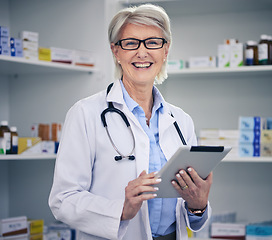 Image showing Senior woman, pharmacist and tablet portrait with medical stock and digital research. Pharmacy, healthcare store and pills with elderly female employee with a smile with work data information