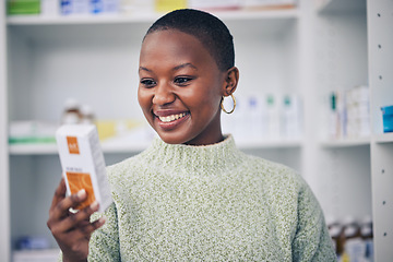 Image showing Happy black woman, customer and box of medicine for medical medication at the pharmacy. African female person or patient shopping pharmaceutical product or drugs for healthcare cure at clinic store