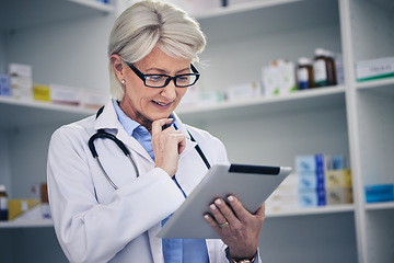 Image showing Senior woman, pharmacist and tablet reading with medical stock and digital telehealth work. Pharmacy, healthcare store and pills with elderly female employee with a smile with research information