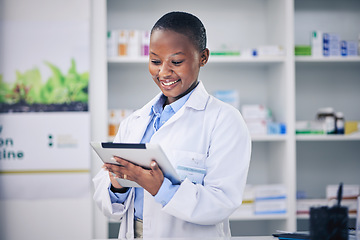 Image showing Black woman, happy pharmacist and tablet for healthcare, telehealth and research in pharmacy, drugstore or shop. Medical professional, technology and African doctor with wellness email for medicine.