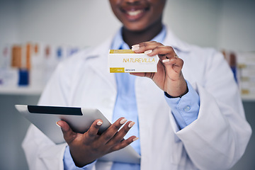 Image showing Black woman, pharmacist and hands with tablet, medicine and skincare supplements in pharmacy, drugstore and healthcare. Medical professional, technology or doctor with pills for anesthesia in surgery