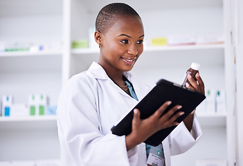 Image showing Happy black woman, pharmacist and tablet for inventory inspection or checking stock at the pharmacy. African female person in medical healthcare with pharmaceutical product or checklist on technology