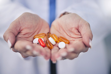 Image showing Woman, pharmacist and palm hands with pills for cure, pain relief or medication at pharmacy store. Closeup of female person, medical or healthcare professional with tablets, drugs or pharmaceuticals