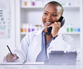 Image showing Black woman, pharmacist and phone call for Telehealth, consultation or customer support at the pharmacy. Happy African female person, medical or healthcare professional talking on telephone at clinic