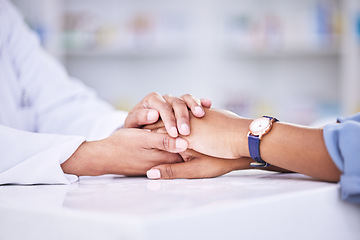 Image showing Woman, pharmacist and holding hands for healthcare, support or trust on counter at the pharmacy. Closeup of female person or medical professional with patient in care for consultation, help or advice