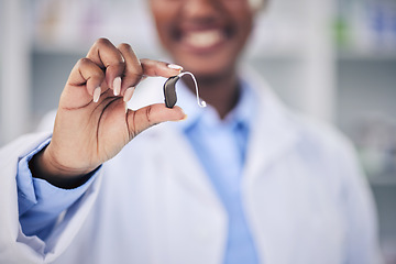 Image showing Woman, pharmacist and hands with hearing aid holding listening device for healthcare at the pharmacy. Closeup of deaf person or medical professional with ear piece in audiology for sound at clinic