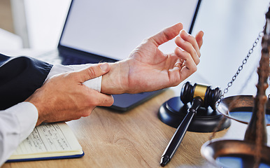 Image showing Hands of person, wrist and pain of lawyer at desk, office and law firm. Closeup of advocate, legal worker and attorney in injury, carpal tunnel and health risk of arthritis, muscle stress and problem