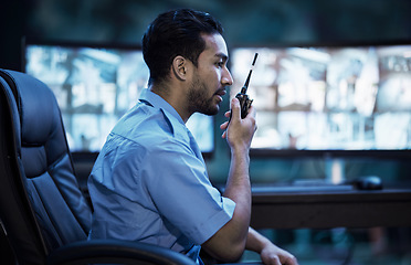 Image showing Security guard in control room, man with radio and screen to check cctv in virtual office for alarm. Safety, surveillance and agent, video to monitor crime and privacy for communication in protection