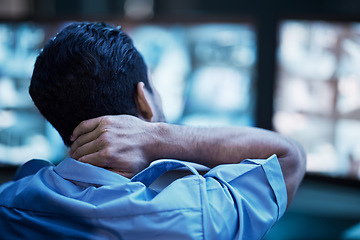 Image showing Security, injury and man with neck pain at work from anxiety, surveillance burnout or stress. Emergency, medical accident and back of a worker with a muscle problem, sick or bad posture in an office