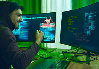 Image showing Cybersecurity, crime and happy man programming in neon office with code, fraud and hacking with hoodie. Software, ransomware and hacker on cyber attack, password thief coding online scam and success.