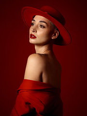 Image showing Mindset, fashion and a model woman on a red studio background for elegant or trendy style. Future, vision and beauty with a young female person thinking in an edgy or classy outfit for aesthetic art