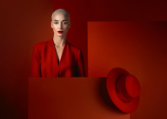 Image showing Fashion, portrait and a bald woman on a red background for cosmetics, sexy or vintage aesthetic. Serious, luxury and a young model or girl branding or advertising makeup isolated on a studio backdrop