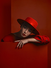 Image showing Fashion, portrait and a vintage woman on a red background for a sexy or creative aesthetic. Retro, rich and an elegant, classy or stylish model or girl with cosmetics isolated on a studio backdrop