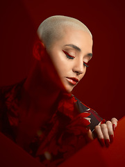 Image showing Woman, beauty and red aesthetic with fashion and art deco, makeup and shine isolated on studio background. Female model, skin glow with bold cosmetics, young female model with glamour and creative