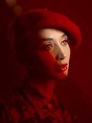 Image showing Woman, fashion and makeup with red aesthetic, beauty and art deco with vintage hat isolated on studio background. Retro style, female model with thinking face and cosmetics, attractive and bold