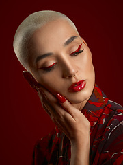 Image showing Woman, beauty and red makeup with fashion and art deco, aesthetic and shine isolated on studio background. Female model, skin glow with bold cosmetics, young female model with glamour and creative