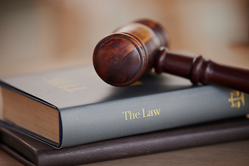 Image showing Background, gavel and law books on table of attorney, judge and justice for courtroom. Closeup of legal hammer, notebook and desk of lawyer in constitution of truth, fair information and human rights