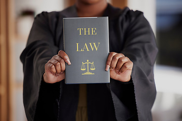 Image showing Hands, lawyer or advocate with book, constitution research or education for learning the justice system. Woman, judge or closeup of attorney studying knowledge, guide or information for legal agency