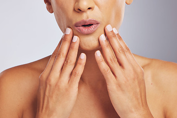 Image showing Lips, pouting or hands of a woman for skincare, beauty or dermatology wellness. Closeup, anti aging and mouth or manicure of a model for cosmetic nails or glow isolated on a studio background