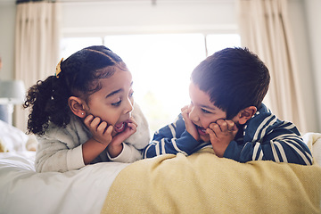 Image showing Bed, talking and boy with girl, relax and excited with a story, home and gossip, secret or storytelling. Siblings, sister or brother in a bedroom, speaking or fun for happy children in conversation