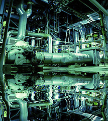 Image showing Pipes, tubes, machinery and steam turbine at a power plant with 