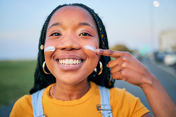 Image showing Portrait, smile and a black woman with sunscreen on her face to protect her skin using spf treatment. Summer, street and blurred background with a happy young female person outdoor to apply lotion