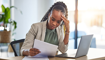 Image showing Laptop, document and businesswoman with stress in the office while working on a project deadline. Overworked, computer and African female lawyer with burnout reading legal paperwork in the workplace.