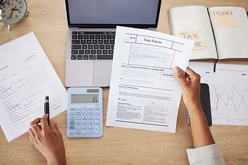 Image showing Taxes form, documents and business person for financial application, audit and time management on computer. Laptop, calculator and accountant or people hands for finance paperwork and accounting