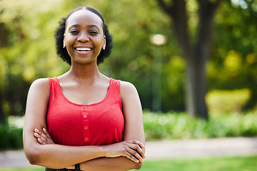 Image showing Portrait, arms crossed and happy black woman in park, outdoor and garden with confidence, funny mood and freedom in Nigeria. Face, african female person and laughing and smile in summer in nature