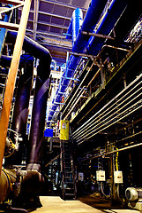 Image showing Pipes, tubes, machinery and steam turbine at a power plant