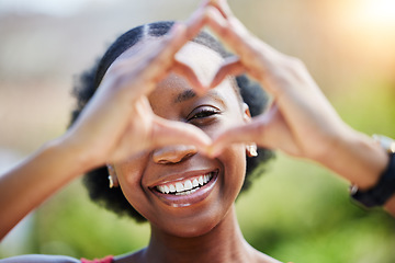 Image showing Portrait, smile and heart sign with black woman outdoor with sun or freedom for health, Happiness, girl and love hands in nature with care or like expression in garden or closeup with emoji in summer