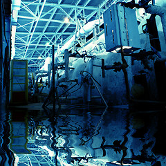 Image showing plenty of pipelines at a industrial factory with reflection