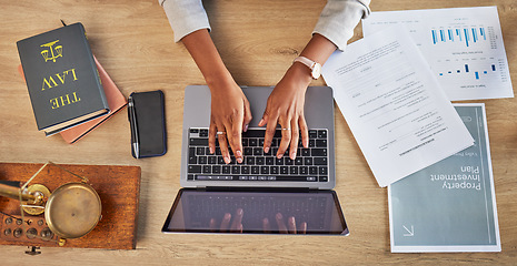 Image showing Lawyer, hands and laptop typing with divorce case and notes with website in a office. Desk, top view and law firm with planning paperwork for settlement report with contract document with computer