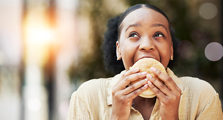 Image showing Mockup, fast food and black woman eating a burger in an outdoor restaurant as a lunch meal craving deal. Breakfast, sandwich and young female person or customer enjoying a tasty unhealthy snack